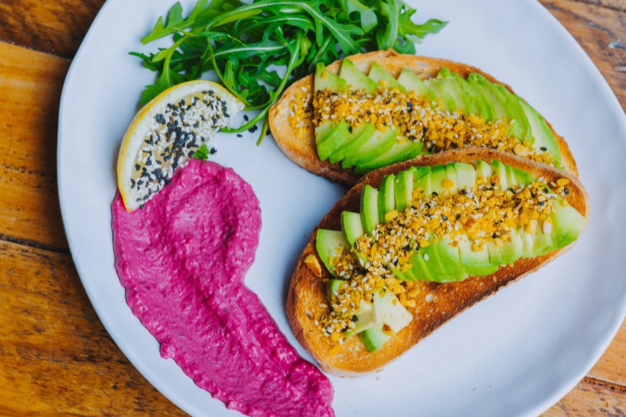 Avocado toast and beetroot dip styled for a cafe menu